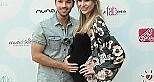 Nathan Kress with pregnant wife on the red carpet in California