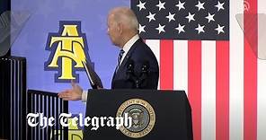 Moment Joe Biden shakes hands with thin air after speech
