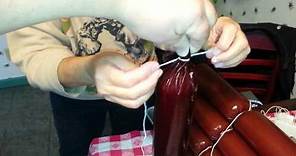 How to stuff a summer sausage and tie it off.