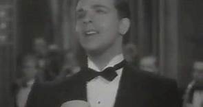 Twenty Million Sweethearts (1934) -- Dick Powell sings "Fair and Warmer."