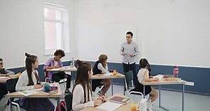 Teacher Teaching the Students Inside a Classroom - Free Stock Videos