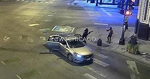 Moment woman is robbed by armed gunmen on Chicago street corner
