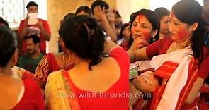 Married Indian women in ritual of Sindur khela: Kolkata Durga puja