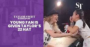 Taylor Swift in Singapore: Young fan is given Taylor's 22 hat