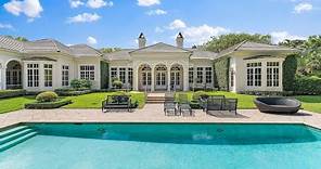 A $9,995,000 Charming one-story home in Jupiter, Florida offers timeless elegance and serenity