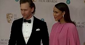 Tom Hiddleston looks besotted as he holds hands with Zawe Ashton