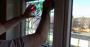 Applying Peels of London stained glass window film to your window.