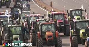 French farmers threaten to besiege Paris in tractor protest