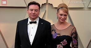 Mike Myers and his wife Kelly Tisdale embrace at 2019 Oscars