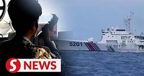 Philippines release videos of confrontation with China military ships