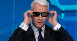 Anderson Cooper tries on sunglasses for solar eclipse