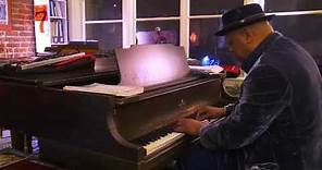 Cuban piano master Chuchito Valdes plays solo piano at Allison Lovejoy's salon.