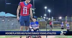 Moore High School football team shows support for MYBA Courage League