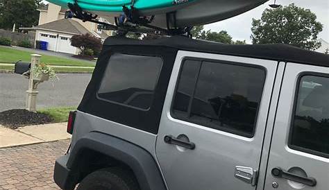 Jeep Wrangler with the Hitchmount-Rack System holding two kayaks
