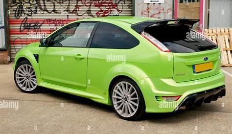 Lime Green Ford Focus RS against a graffiti covered wall Stock Photo