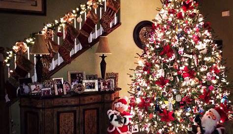 a decorated christmas tree with santa claus and other decorations in