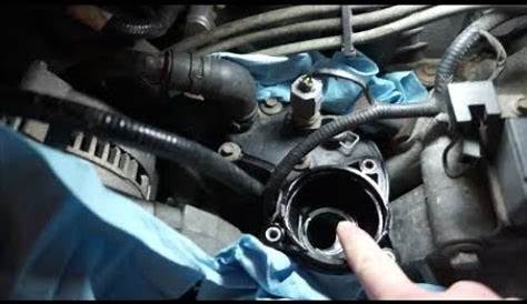 replace thermostat housing 2006 ford explorer