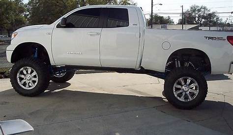 Lifted White Toyota Tundra with RBP 94R Chrome with White Inserts