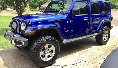 blue four door jeep wrangler