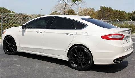 white ford fusion with black rims