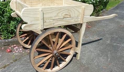 a cool little replica rustic hand cart, built as a garden display but