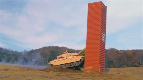 Driverless tank obliterates a shipping container