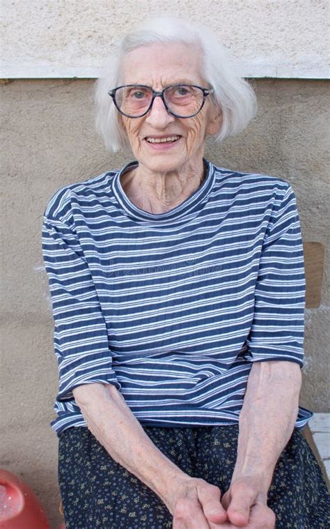 Portrait Of A Ninety Years Old Grandma With Walking Stick Outdoo Stock