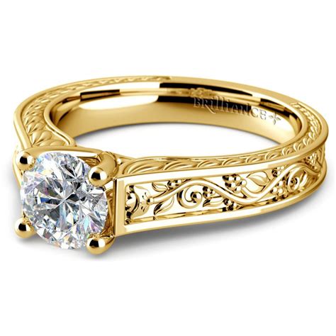 Yellow gold engagement rings make the perfect ring for anyone looking to for a diamond with a lower color grade. Antique Floral Solitaire Engagement Ring in Yellow Gold