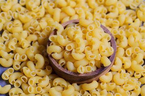 Raw Macaroni On Wooden Bowl Pasta Uncooked On Background Italian Food