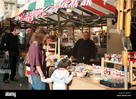 A Mother And Child Buying British The Market Market Square Cambridge