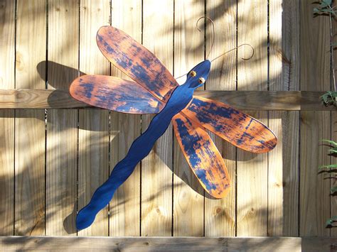 We were bowled over the minute we spied these amazing creations from 'lucy designs'. "Auburn" Dragonfly made from fan blades and fence posts ...