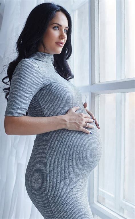 Pregnant Brunette Woman In A Grey Dress Brunette Woman