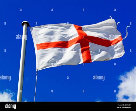 English Flag Known As St Georges Cross Flying With Blue Sky Behind