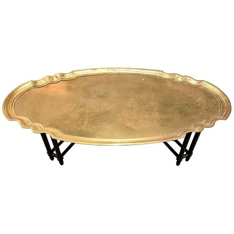 The legs are fancily turned with a carved all over design and shell inserts. Baker Furniture Large Brass Tray Coffee Cocktail Table For ...