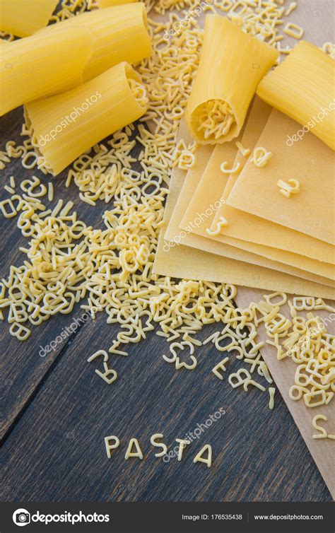 Uncooked Raw Pasta Alphabet Yellow Letters With Macaroni And Lasagna ⬇