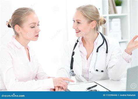 Doctor And Patient During Personal Consulting In Hospital Stock Photo