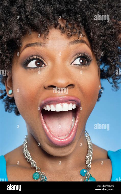 Surprised African American Woman Looking Away With Mouth Open Stock