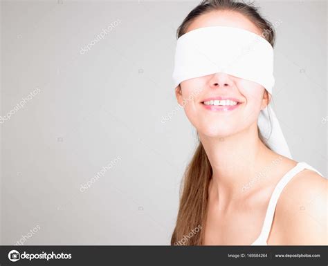Woman Blindfolded Smiling Isolated Grey Background Stock Photo By Imagesource