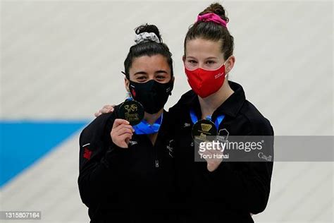 Meaghan Benfeito And Caeli Mckay Of Canada Pose With Their Gold News