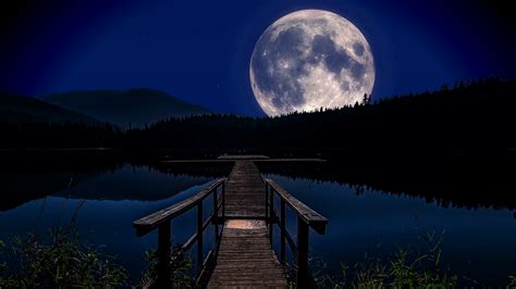 Moon Rising Over A Tranquil Forest Lake Against A Starry Night Sky