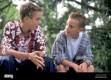 Two Teenage Boys Talking Together Stock Photo Alamy