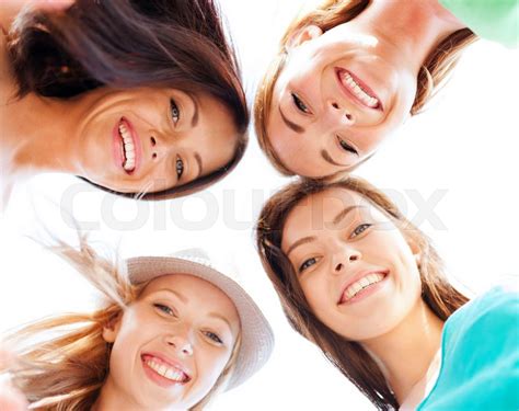 Faces Of Girls Looking Down And Smiling Stock Image Colourbox
