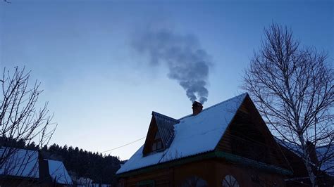 Wooden House In The Mountains Smoke From Chimney Action In Winter Time
