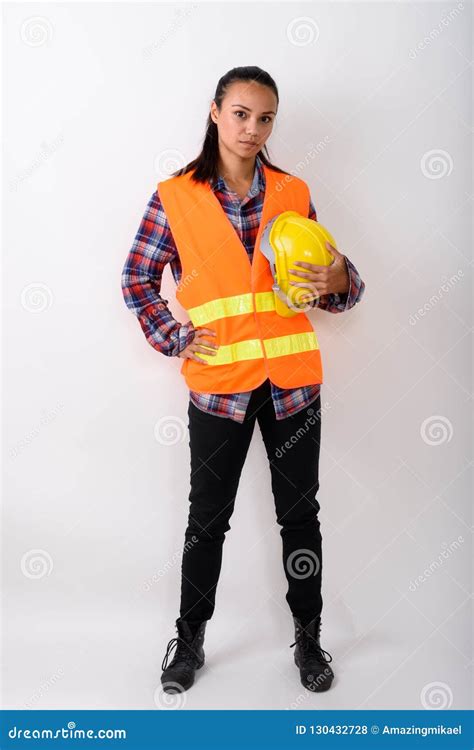 Full Body Shot Of Young Asian Woman Construction Worker Standing Stock