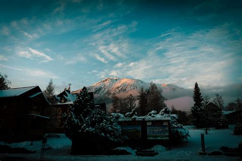 Houses Near Snow Caped Mountain · Free Stock Photo