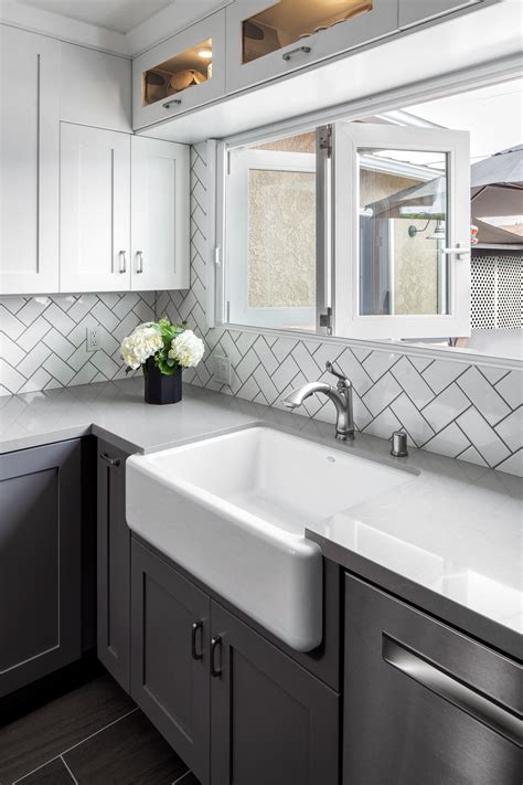 Vertical Subway Tile White Kitchen Cabinets Black Counter Top