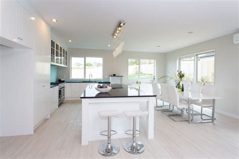 Some mdf cabinets have a plastic coating, and removing a plastic coating from kitchen cabinets is usually easier than removing a wood laminate. white pine flooring with glossy white kitchen cabinets so ...