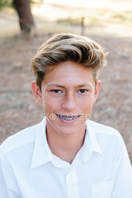 Portrait Of A Handsome Teen Boy With Brown Eyes And Braces — Beauty