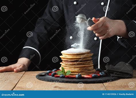 Serving Pancakes With Powdered Sugar And Berries Chef Woman Hand
