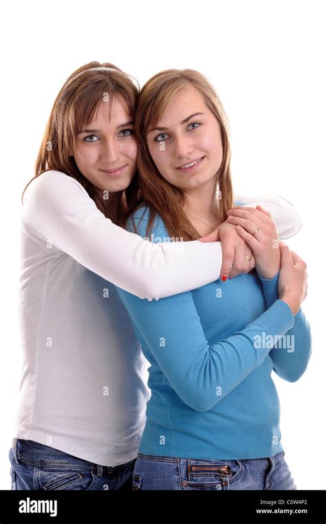 Two Young Women Hugging Each Other Isolated On White Stock Photo Alamy